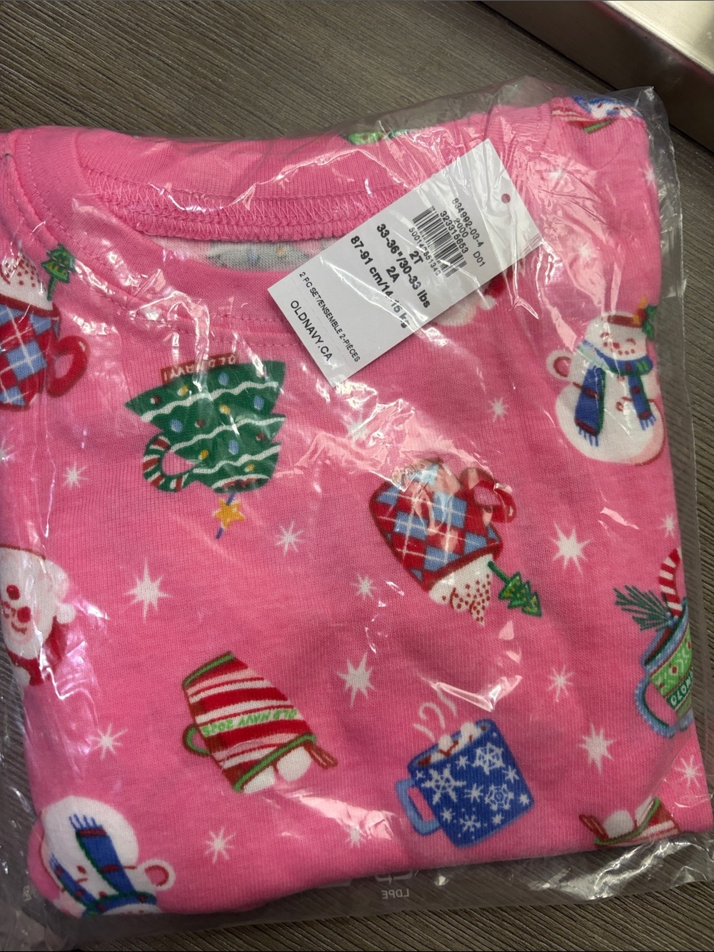 Kids Pink Holiday Pajama Top with Festive Mug and Snowman Print